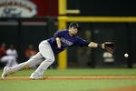 PHOENIX, AZ - MAY 05:  Infielder Ian Stewart #9 of the Colorado Rockies makes a diving attempt at a single hit by the Arizona Diamondbacks during the Major League Baseball game at Chase Field on May 5, 2011 in Phoenix, Arizona.  (Photo by Christian Petersen/Getty Images)