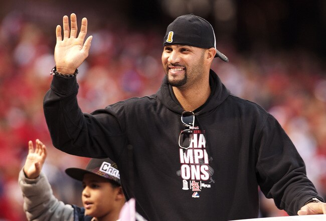 ST. LOUIS, MO - OCTOBER 30: First baseman Albert Pujols of the St. Louis Cardinals waves to the crowd during the World Series victory parade for the franchise's 11th championship on October 30, 2011 in St Louis, Missouri. (Photo by Ed Szczepanski/Getty Images)
