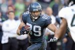 SEATTLE - OCTOBER 11: John Carlson #89 of the Seattle Seahawks carries the ball during the game against the Jacksonville Jaguars on October 11, 2009 at Qwest Field in Seattle, Washington.The Seahawks defeated the Jaguars 41-0.  (Photo by Otto Greule Jr/Getty Images)