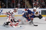 UNIONDALE, NY - DECEMBER 08: Ray Emery #30 and defenseman Niklas Hjalmarsson #4 of the Chicago Blackhawks defend against John Tavares #91 of the New York Islanders at the Nassau Veterans Memorial Coliseum on December 8, 2011 in Uniondale, New York.  (Photo by Bruce Bennett/Getty Images)