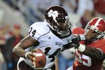 TUSCALOOSA, AL - NOVEMBER 13: Quarterback Chris Reif #14 of the Mississippi State Bulldogs rushes upfield against the Alabama Crimson Tide November 13, 2010 at Bryant-Denny Stadium in Tuscaloosa, Alabama.  (Photo by Al Messerschmidt/Getty Images)