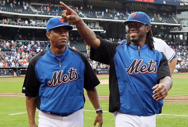 NEW YORK, NY - SEPTEMBER 28:  Jose Reyes #7 (R) of the New York Mets walks off the field with bullpen pitcher Liliano Castro after the game against the Cincinnati Reds at Citi Field on September 28, 2011 in the Flushing neighborhood of the Queens borough of New York City. The Mets defeated the Reds 3-0. Reyes is an unrestricted free agent at the end of the season. Reyes also ended the game with a narrow lead for the National League batting title.  (Photo by Jim McIsaac/Getty Images)