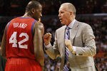 MIAMI, FL - MARCH 25:  Coach Doug Collins and Guard Elton Brand #42 of the Philadelphia Sixers chat against the Miami Heat at American Airlines Arena on March 25, 2011 in Miami, Florida. The Heat defeated the Sixers 111-99. NOTE TO USER: User expressly acknowledges and agrees that, by downloading and/or using this Photograph, User is consenting to the terms and conditions of the Getty Images License Agreement.  (Photo by Marc Serota/Getty Images)