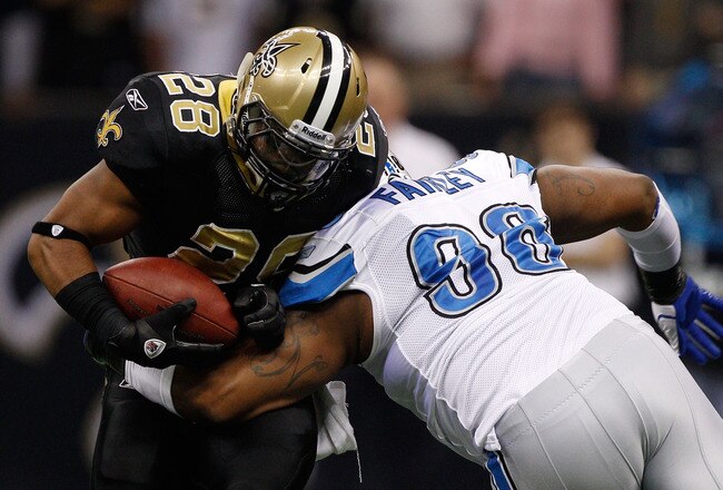 NEW ORLEANS, LA - DECEMBER 04:  Running back Mark Ingram #28 of the New Orleans Saints is hit by defensive tackle Nick Fairley #98 of the Detroit Lions in the first quarter at Mercedes-Benz Superdome on December 4, 2011 in New Orleans, Louisiana.  (Photo by Chris Graythen/Getty Images)