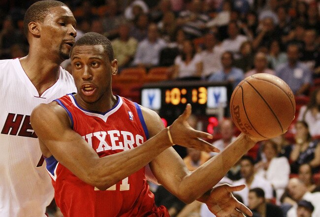 MIAMI, FL - MARCH 25:  Forward Thaddeus Young #21 of the Philadelphia Sixers drives against Forward Chris Bosh #1 of the Miami Heat at American Airlines Arena on March 25, 2011 in Miami, Florida. The Heat defeated the Sixers 111-99. NOTE TO USER: User expressly acknowledges and agrees that, by downloading and/or using this Photograph, User is consenting to the terms and conditions of the Getty Images License Agreement.  (Photo by Marc Serota/Getty Images)