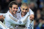 MADRID, SPAIN - NOVEMBER 22:  Karim Benzema (R) of Real Madrid celebrates with Gonzalo Higuain (C) and Jose Callejon and  after scoring his team's 6th goal  team's 6th goal during the UEFA Champions League group D match between Real Madrid and Dinamo Zagreb at Estadio Santiago Bernabeu on November 22, 2011 in Madrid, Spain.  (Photo by Denis Doyle/Getty Images)