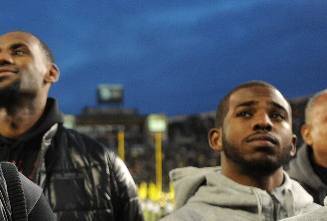EUGENE, OR - NOVEMBER 19: (L-R) Dwyane Wade, LeBron James and Chris Paul look on the sidelines before the game between the Oregon Ducks and the USC Trojans at Autzen Stadium on November 19, 2011 in Eugene, Oregon. (Photo by Steve Dykes/Getty Images)