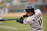 OAKLAND, CA - MAY 13:  Omar Vizquel #11 of the Chicago White Sox doubles to right field to score Carlos Quentin #20 of the Chicago White Sox inn the second inning against the Oakland Athletics at Oakland-Alameda County Coliseum on May 13, 2011 in Oakland, California.  (Photo by Ezra Shaw/Getty Images)