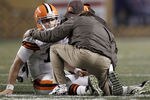 PITTSBURGH, PA - DECEMBER 08:  Colt McCoy #12 of the Cleveland Browns lays on the ground while speaking to athletic trainers after a helmet to helmet hit from James Harrison #92 of the Pittsburgh Steelers during the game on December 8, 2011 at Heinz Field in Pittsburgh, Pennsylvania.  (Photo by Jared Wickerham/Getty Images)