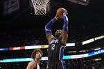 PHOENIX, AZ - MARCH 13:  Dwight Howard #12 of the Orlando Magic slam dunks the ball over Robin Lopez #15 of the Phoenix Suns during the NBA game at US Airways Center on March 13, 2011 in Phoenix, Arizona.  NOTE TO USER: User expressly acknowledges and agrees that, by downloading and or using this photograph, User is consenting to the terms and conditions of the Getty Images License Agreement.  (Photo by Christian Petersen/Getty Images)