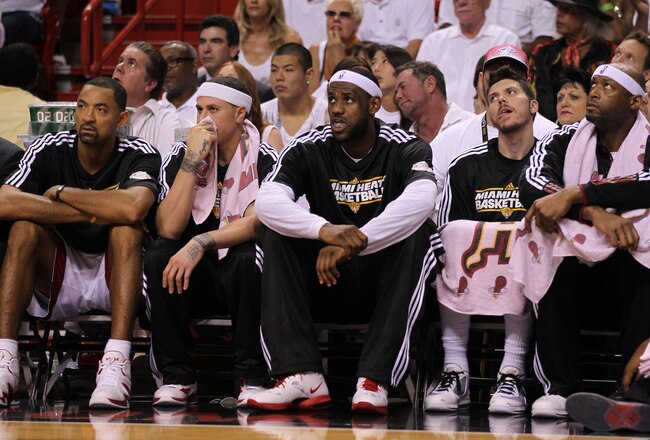 MIAMI, FL - JUNE 12:  (L-R) Juwan Howard #5, Mike Bibby #0, LeBron James #6, Mike Miller #13 and Erick Dampier #25 of the Miami Heat look on from the bench in the first half against the Dallas Mavericks in Game Six of the 2011 NBA Finals at American Airlines Arena on June 12, 2011 in Miami, Florida. NOTE TO USER: User expressly acknowledges and agrees that, by downloading and/or using this Photograph, user is consenting to the terms and conditions of the Getty Images License Agreement.  (Photo by Mike Ehrmann/Getty Images)