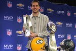 DALLAS, TX - FEBRUARY 07:  Green Bay Packers quarterback Aaron Rodgers poses with the MVP trophy after speaking to the media during a press conference at Super Bowl XLV Media Center on February 7, 2011 in Dallas, Texas.  (Photo by Streeter Lecka/Getty Images)
