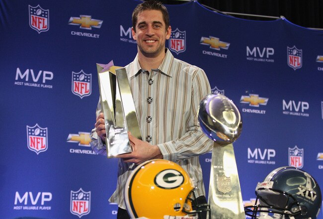 DALLAS, TX - FEBRUARY 07:  Green Bay Packers quarterback Aaron Rodgers poses with the MVP trophy after speaking to the media during a press conference at Super Bowl XLV Media Center on February 7, 2011 in Dallas, Texas.  (Photo by Streeter Lecka/Getty Images)
