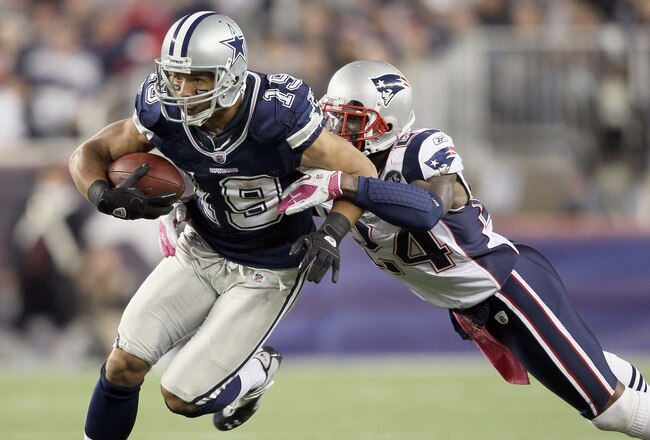 FOXBORO, MA - OCTOBER 16:  Miles Austin #19 of the Dallas Cowboys carries the ball as  Kyle Arrington #24 of the New England Patriots defends on October 16, 2011 at Gillette Stadium in Foxboro, Massachusetts. The New England Patriots defeated the Dallas Cowboys 20-16.  (Photo by Elsa/Getty Images)