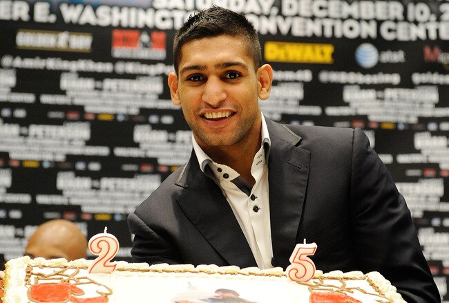 WASHINGTON, DC - DECEMBER 08:  Unified Light-Welterweight Champion of the World Amir Khan is presented with a birthday cake during a press conference at Walter E. Washington Convention Center on December 8, 2011 in Washington, DC.  (Photo by Patrick McDermott/Getty Images)