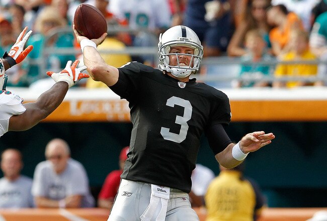 MIAMI GARDENS, FL - DECEMBER 04:   Carson Palmer #3 of the Oakland Raiders passes during a game against the Miami Dolphins at Sun Life Stadium on December 4, 2011 in Miami Gardens, Florida.  (Photo by Mike Ehrmann/Getty Images)