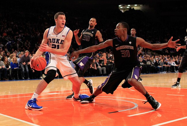 NEW YORK, NY - DECEMBER 10: Miles Plumlee #21 of the Duke Blue Devils controls the ball from Terrence Ross #31 of the Washington Huskies at Madison Square Garden on December 10, 2011 in New York City.  (Photo by Chris Trotman/Getty Images)