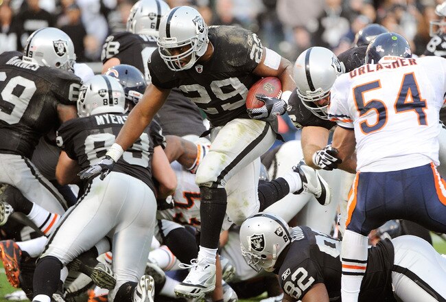 OAKLAND, CA - NOVEMBER 27:  Michael Bush #29 of the Oakland Raiders rushes three yards for a touchdown against the Chicago Bears at O.co Coliseum on November 27, 2011 in Oakland, California.  (Photo by Thearon W. Henderson/Getty Images)