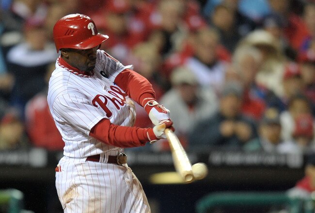 PHILADELPHIA, PA - OCTOBER 02:  Jimmy Rollins #11 of the Philadelphia Phillies hits a single against the St. Louis Cardinals in the seventh inning of Game Two of the National League Division Series at Citizens Bank Park on October 2, 2011 in Philadelphia, Pennsylvania.  (Photo by Drew Hallowell/Getty Images)
