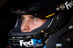 FORT WORTH, TX - NOVEMBER 04:  Denny Hamlin, driver of the #11 FedEx Office Toyota, looks on from his car in the garage during practice for the NASCAR Sprint Cup Series AAA Texas 500 at Texas Motor Speedway on November 4, 2011 in Fort Worth, Texas.  (Photo by Chris Graythen/Getty Images)