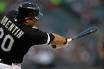 CHICAGO, IL - AUGUST 14: Carlos Quentin #20 of the Chicago White Sox hits a run-scoring double in the 1st inning against the Texas Rangers at U.S. Cellular Field on August 19, 2011 in Chicago, Illinois. (Photo by Jonathan Daniel/Getty Images)