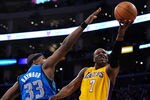LOS ANGELES, CA - MAY 04:  Lamar Odom #7 of the Los Angeles Lakers goes up for a shot against Brendan Haywood #33 of the Dallas Mavericks in the second half in Game Two of the Western Conference Semifinals in the 2011 NBA Playoffs at Staples Center on May 4, 2011 in Los Angeles, California. NOTE TO USER: User expressly acknowledges and agrees that, by downloading and or using this photograph, User is consenting to the terms and conditions of the Getty Images License Agreement.  (Photo by Kevork Djansezian/Getty Images)