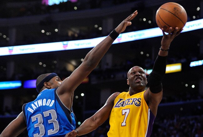 LOS ANGELES, CA - MAY 04:  Lamar Odom #7 of the Los Angeles Lakers goes up for a shot against Brendan Haywood #33 of the Dallas Mavericks in the second half in Game Two of the Western Conference Semifinals in the 2011 NBA Playoffs at Staples Center on May 4, 2011 in Los Angeles, California. NOTE TO USER: User expressly acknowledges and agrees that, by downloading and or using this photograph, User is consenting to the terms and conditions of the Getty Images License Agreement.  (Photo by Kevork Djansezian/Getty Images)