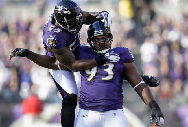 BALTIMORE, MD - DECEMBER 11:  Terrell Suggs #55 of the Baltimore Ravens celebrates with teammate Cory Redding #93 of the Baltimore Ravens after Redding sacked  Dan Orlovsky #6 of the Indianapolis Colts during the first half at M&T Bank Stadium on December 11, 2011 in Baltimore, Maryland.  (Photo by Rob Carr/Getty Images)