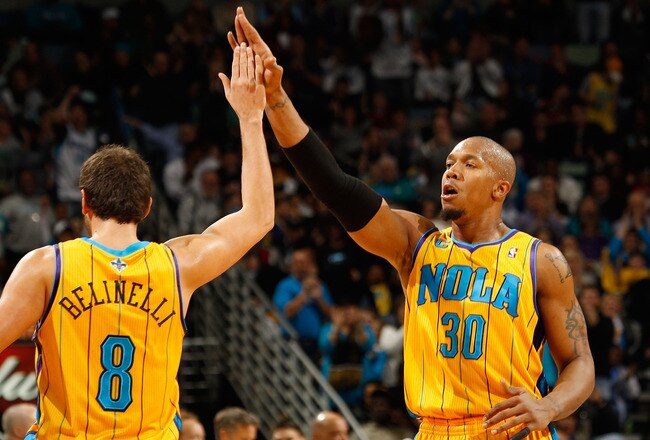 NEW ORLEANS, LA - JANUARY 22:  David West #30 and Marco Belinelli #8 of the New Orleans Hornets celebrate during the game against the San Antonio Spurs at the New Orleans Arena on January 22, 2011 in New Orleans, Louisiana.  The Hornets defeated the Spurs 96-72.  NOTE TO USER: User expressly acknowledges and agrees that, by downloading and/or using this photograph, User is consenting to the terms and conditions of the Getty Images License Agreement.  (Photo by Chris Graythen/Getty Images)