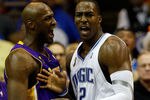 ORLANDO, FL - JUNE 11:  Lamar Odom #7 of the Los Angeles Lakers and Dwight Howard #12 of the Orlando Magic react in the fourth quarter of Game Four of the 2009 NBA Finals on June 11, 2009 at Amway Arena in Orlando, Florida.  NOTE TO USER:  User expressly acknowledges and agrees that, by downloading and or using this photograph, User is consenting to the terms and conditions of the Getty Images License Agreement.  (Photo by Chris Graythen/Getty Images)
