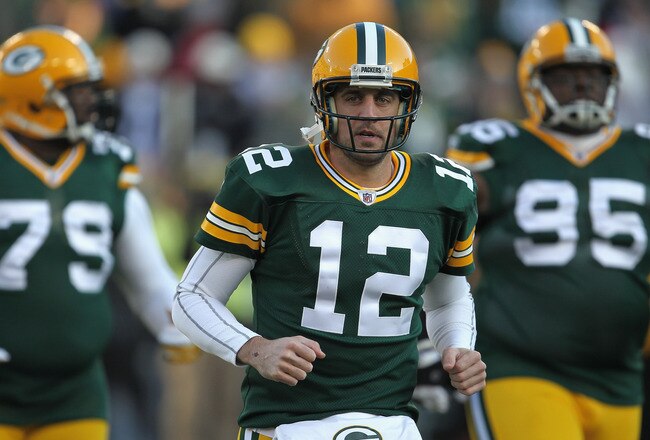 GREEN BAY, WI - DECEMBER 11: Aaron Rodgers #12 of the Green Bay Packers participates in warm-ups before a game against the Oakland Raiders at Lambeau Field on December 11, 2011 in Green Bay, Wisconsin. (Photo by Jonathan Daniel/Getty Images)