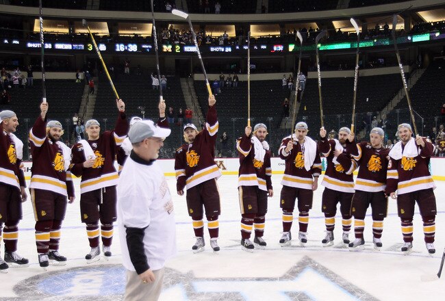 ST. PAUL, MN - APRIL 09:  The Minnesota Duluth Bulldogs celebrate the win after the championship game of the 2011 NCAA Men's Frozen Four on April 9, 2011 at the Xcel Energy Center in St. Paul, Minnesota. The Minnesota Duluth Bulldogs defeated the Michigan Wolverines 3-2 in overtime.  (Photo by Elsa/Getty Images)