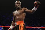 LAS VEGAS, NV - NOVEMBER 12:  Timothy Bradley celebrates after knocking down Joel Casamayor before Casamayor's trainer Miguel Diaz stopped the right in the eighth round in their WBO junior welterweight title fight at the MGM Grand Garden Arena on November 12, 2011 in Las Vegas, Nevada.  (Photo by Harry How/Getty Images)