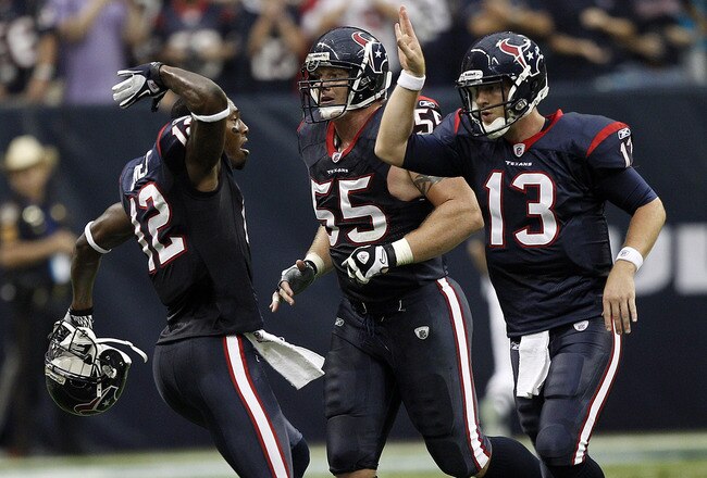 HOUSTON - DECEMBER 04:  Quarterback TJ Yates #13 of the Houston Texans receives high fives from Jacoby Jones #12 and Chris Myers #55 after throwing  a touchdown pass in the second quarter at Reliant Stadium on December 4, 2011 in Houston, Texas.  (Photo by Bob Levey/Getty Images)