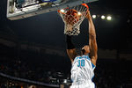 NEW ORLEANS, LA - DECEMBER 26:  David West #30 of the New Orleans Hornets dunks the ball over Marvin Williams #24 of the Atlanta Hawks at the New Orleans Arena on December 26, 2010 in New Orleans, Louisiana.  NOTE TO USER: User expressly acknowledges and agrees that, by downloading and or using this photograph, User is consenting to the terms and conditions of the Getty Images License Agreement.  (Photo by Chris Graythen/Getty Images)