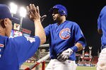 CINCINNATI, OH - SEPTEMBER 12:   Aramis Ramirez #16 of the Chicago Cubs receives congratulations after hitting a home run during the game against the Cincinnati Reds on September 12, 2011 at Great American Ball Park in Cincinnati, Ohio.  The Cubs defeated the Reds 12-8.  (Photo by John Grieshop/Getty Images)