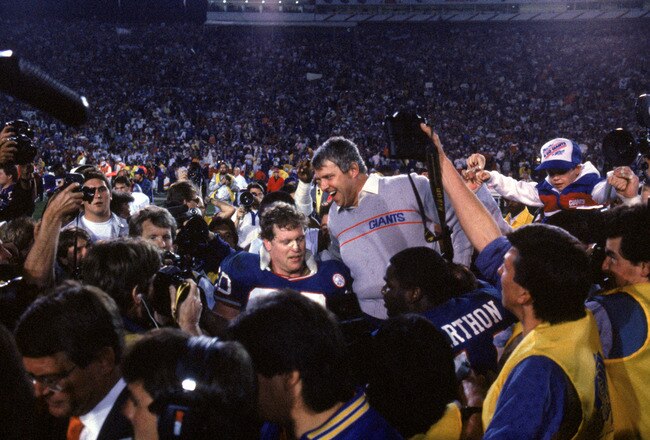 PASADENA, CA - JANUARY 25:  Head coach Bill Parcells of the New York Giants gets carried off the field following the game against the Denver Broncos during Super Bowl XXI at the Rose Bowl on January 25, 1987 in Pasadena, California. The Giants defeated the Broncos 39-20. (Photo by George Rose/Getty Images)