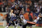 DENVER, CO - DECEMBER 11:  Quarterback Tim Tebow #15 of the Denver Broncos breaks a tackle by linebacker Brian Urlacher #54 of the Chicago Bears as he scrambles during the overtime period at Sports Authority Field at Mile High on December 11, 2011 in Denver, Colorado. The Broncos defeated the Bears 13-10.  (Photo by Doug Pensinger/Getty Images)
