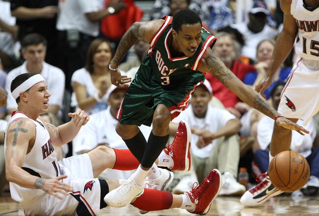 ATLANTA - MAY 2:  Guard Brandon Jennings #3 of the Milwaukee Bucks loses the ball while guard Mike Bibby #10 of the Atlanta Hawks defends him during Game Seven of the Eastern Conference Quarterfinals during the 2010 NBA Playoffs at Philips Arena on May 2, 2010 in Atlanta, Georgia. The Hawks beat the Bucks 95-74.  NOTE TO USER: User expressly acknowledges and agrees that, by downloading and/or using this photograph, user is consenting to the terms and conditions of the Getty Images License Agreement.  (Photo by Mike Zarrilli/Getty Images)