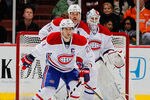 ANAHEIM, CA - NOVEMBER 30:  (L-R) Brian Gionta #21, Hal Gill #75 and goaltender Peter Budaj #30 of the Montreal Canadiens defend against the Anaheim Ducks at Honda Center on November 30, 2011 in Anaheim, California.  (Photo by Jeff Gross/Getty Images)