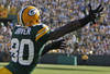GREEN BAY, WI - OCTOBER 2:Donald Driver #80 of the Green Bay Packers reaches to make a catch while being covered by Jonathan Wilhite #29 of the Denver Broncos at Lambeau Field on October 2, 2011 in Green Bay, Wisconsin. (Photo by Matt Ludtke /Getty Images)