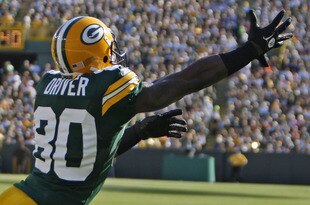 GREEN BAY, WI - OCTOBER 2:Donald Driver #80 of the Green Bay Packers reaches to make a catch while being covered by Jonathan Wilhite #29 of the Denver Broncos at Lambeau Field on October 2, 2011 in Green Bay, Wisconsin. (Photo by Matt Ludtke /Getty Images)