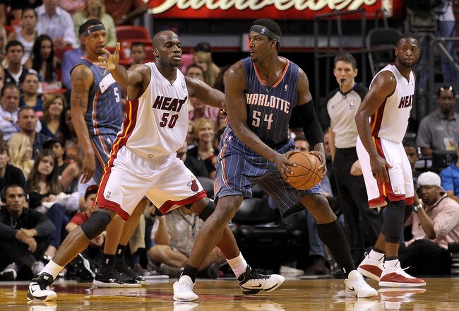 MIAMI, FL - APRIL 08:  Kwame Brown #54 of the Charlotte Bobcats posts up Joel Anthony #50 of the Miami Heat during a game at American Airlines Arena on April 8, 2011 in Miami, Florida. NOTE TO USER: User expressly acknowledges and agrees that, by downloading and/or using this Photograph, User is consenting to the terms and conditions of the Getty Images License Agreement.  (Photo by Mike Ehrmann/Getty Images)