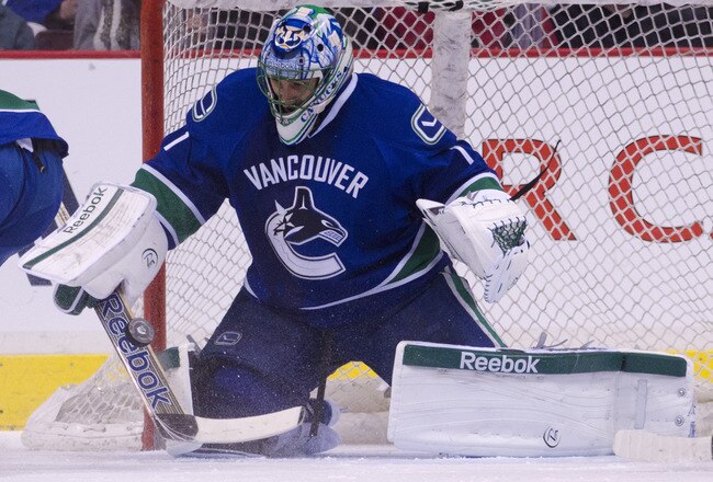 VANCOUVER, CANADA - DECEMBER 4: Goalie Roberto Luongo #1 of the Vancouver Canucks rmakes a save during NHL action on December 04, 2011 against the Calgary Flames at Rogers Arena in Vancouver, British Columbia, Canada.  (Photo by Rich Lam/Getty Images)