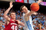 CHAPEL HILL, NC - NOVEMBER 30:  Tyler Zeller #44 of the North Carolina Tar Heels reaches for an overthrown pass as Jared Berggren #40 of the Wisconsin Badgers defends during play at the Dean Smith Center on November 30, 2011 in Chapel Hill, North Carolina. North Carolina won 60-57.  (Photo by Grant Halverson/Getty Images)