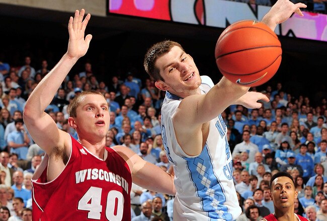 CHAPEL HILL, NC - NOVEMBER 30:  Tyler Zeller #44 of the North Carolina Tar Heels reaches for an overthrown pass as Jared Berggren #40 of the Wisconsin Badgers defends during play at the Dean Smith Center on November 30, 2011 in Chapel Hill, North Carolina. North Carolina won 60-57.  (Photo by Grant Halverson/Getty Images)