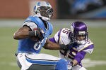 DETROIT, MI - DECEMBER 11:  Calvin Johnson #81 of the Detroit Lions spins out of a tackle after a fourth quarter catch by Marcus Sherels #35 of the Minnesota Vikings at Ford Field on December 11, 2011 in Detroit, Michigan.  (Photo by Gregory Shamus/Getty Images)