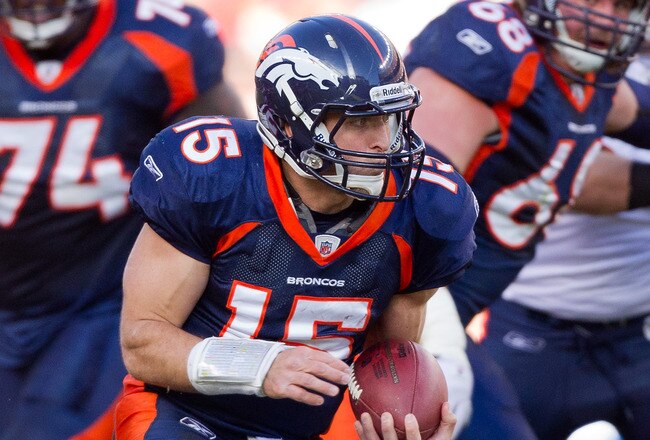 DENVER, CO - DECEMBER 11:  Quarterback Tim Tebow #15 of the Denver Broncos runs with the ball against the Chicago Bears at Sports Authority Field at Mile High on December 11, 2011 in Denver, Colorado. (Photo by Justin Edmonds/Getty Images)