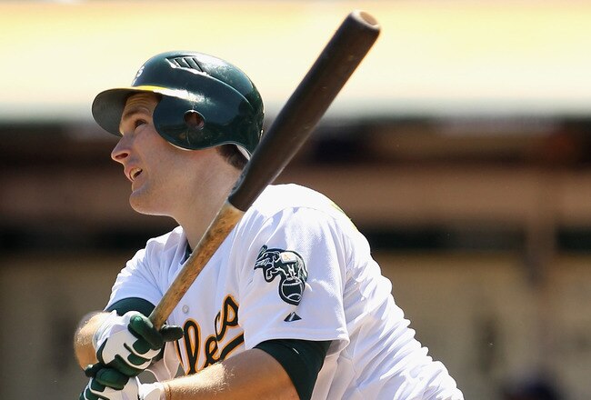 OAKLAND, CA - SEPTEMBER 07:  Josh Willingham #16 of the Oakland Athletics hits a sacrifice fly that scored Coco Crisp #4 of the Oakland Athletics in the first inning of their game against the Kansas City Royals at O.co Coliseum on September 7, 2011 in Oakland, California.  (Photo by Ezra Shaw/Getty Images)