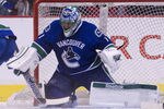 VANCOUVER, CANADA - DECEMBER 4: Goalie Roberto Luongo #1 of the Vancouver Canucks rmakes a save during NHL action on December 04, 2011 against the Calgary Flames at Rogers Arena in Vancouver, British Columbia, Canada.  (Photo by Rich Lam/Getty Images)